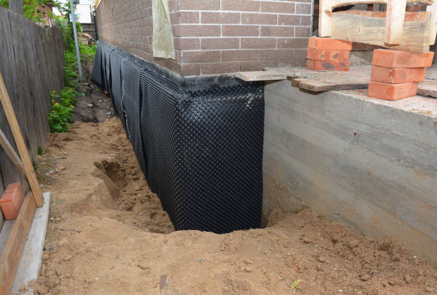 SJ Waterproofing Pros technician performing targeted Vapor Barrier Installation assessment in Benton, TN